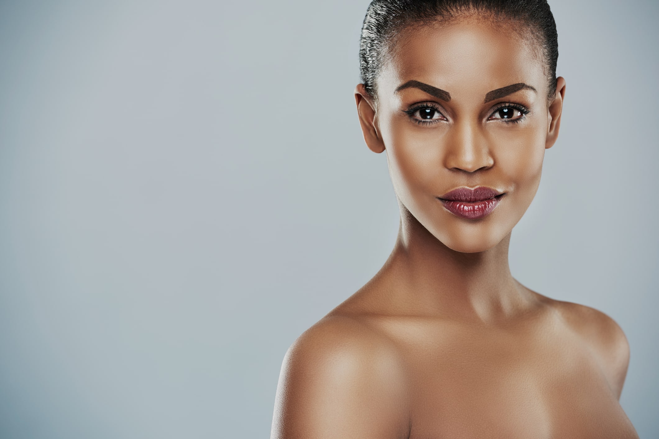 A woman smiling after Sculptra injections in Fort Worth